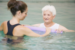 Instructor And Patient Undergoing Water Therapy